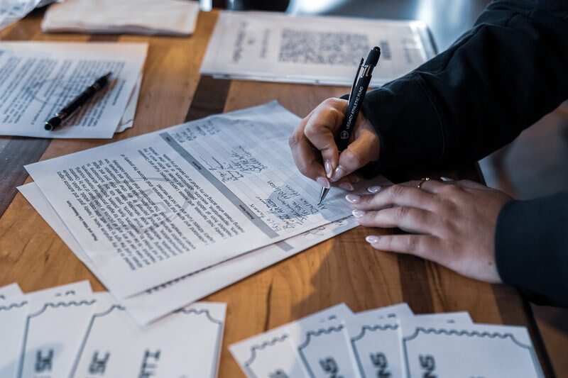 Trivia answer sheets and LAF materials on the table